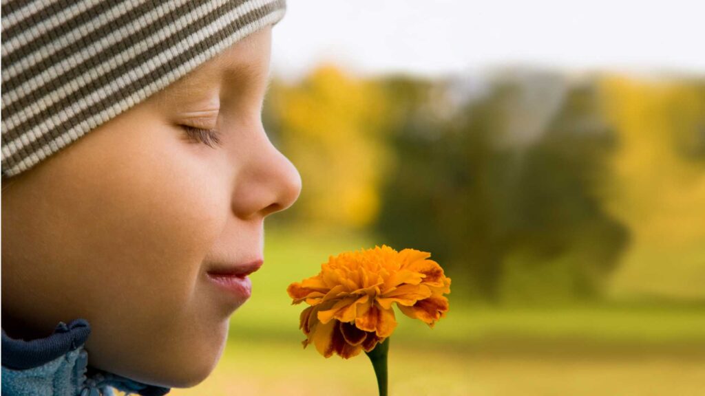 Person smelling nature and having a good time